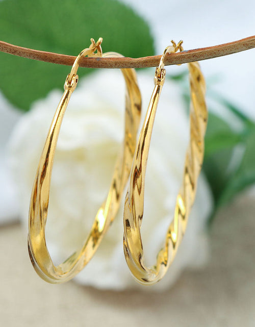 Load image into Gallery viewer, 14K Gold Large Twist Hoop Earrings 60mm
