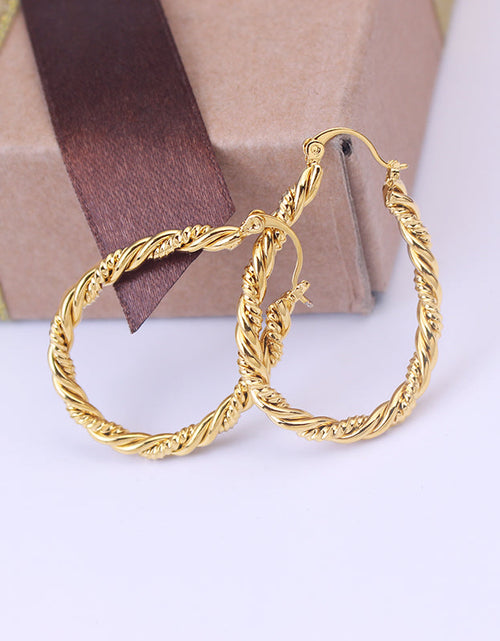 Load image into Gallery viewer, 14k Yellow Gold Large Oval Twisted Hoop Earrings
