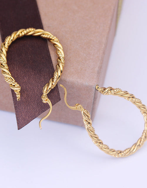 Load image into Gallery viewer, 14k Yellow Gold Large Oval Twisted Hoop Earrings
