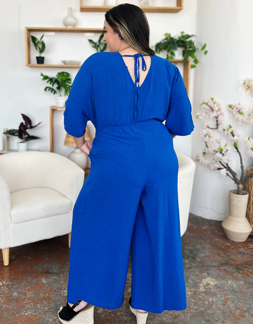Load image into Gallery viewer, Double Take Full Size Surplice Wide Leg Jumpsuit with Pockets
