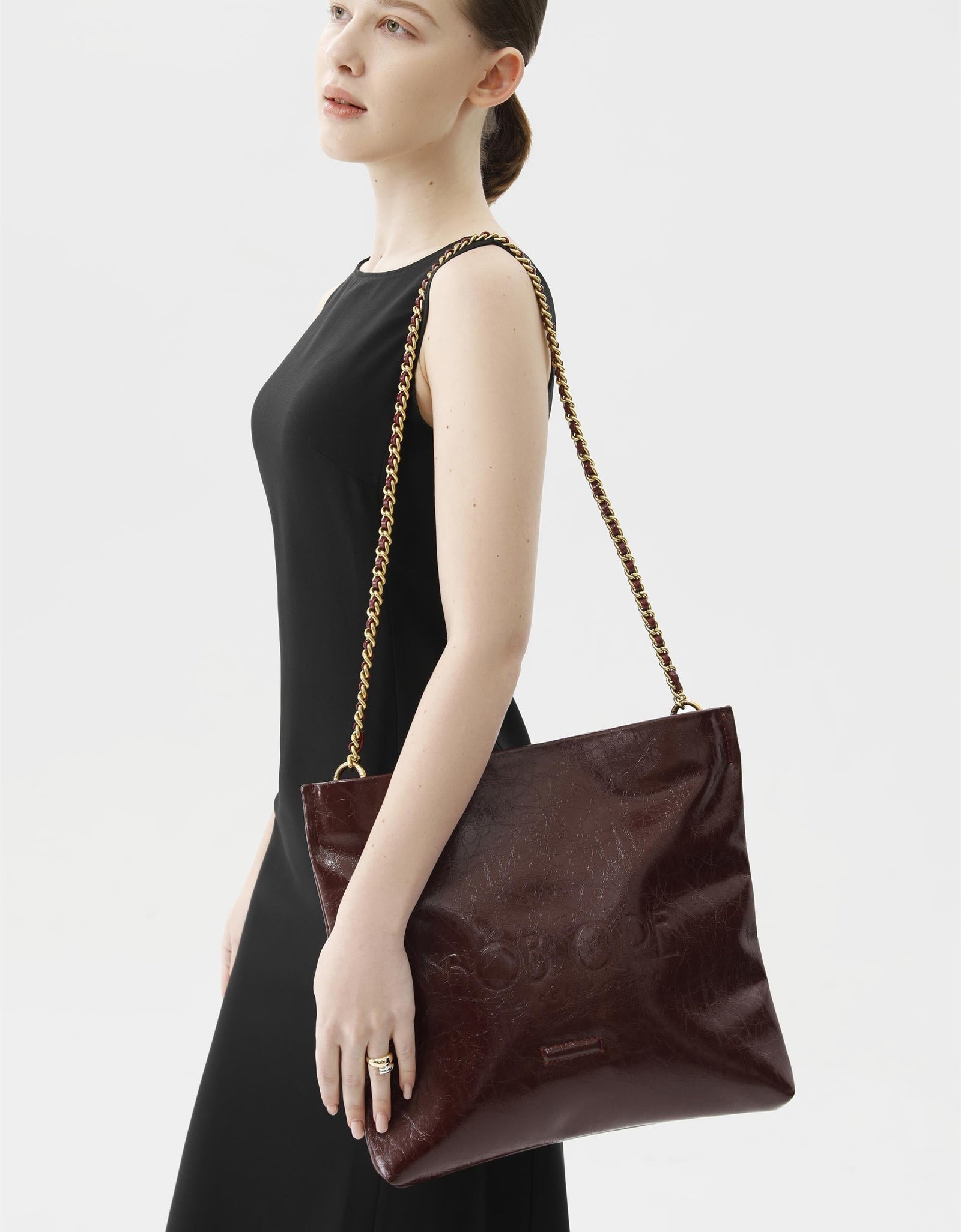 Rei Leather Bag, Red Wine by Bob Oré