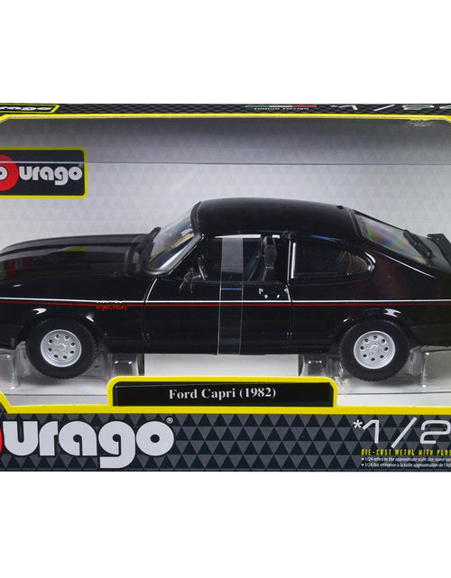 Load image into Gallery viewer, 1982 Ford Capri Black with Stripes 1/24 Diecast Model Car by Bburago
