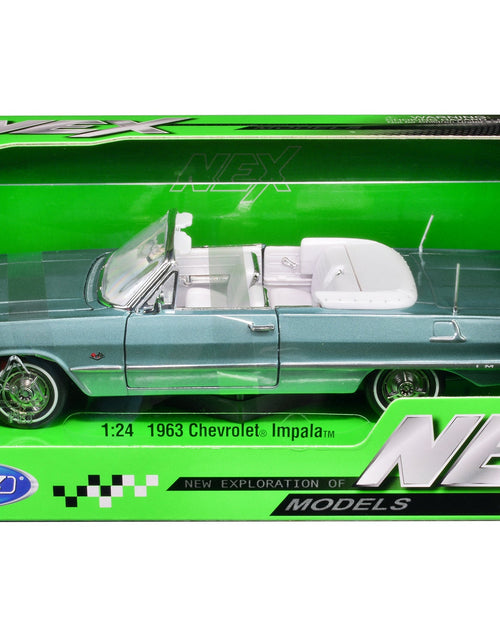 Load image into Gallery viewer, 1963 Chevrolet Impala Convertible Light Blue Metallic with White Interior "NEX Models" 1/24 Diecast Model Car by Welly

