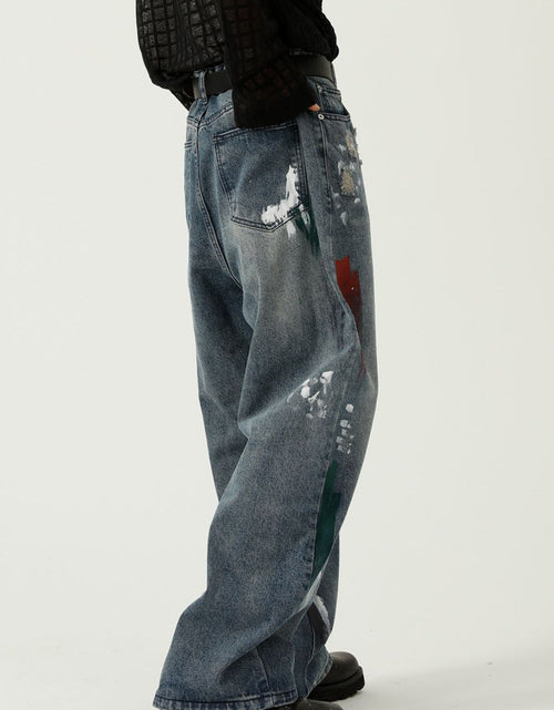 Load image into Gallery viewer, Washed Distressed Wide-Leg Jeans
