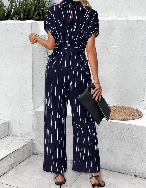 Load image into Gallery viewer, Tied Printed Mock Neck Wide Leg Jumpsuit
