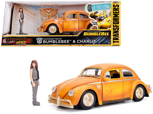 Load image into Gallery viewer, Volkswagen Beetle Weathered Yellow with Robot on Chassis and Charlie Diecast Figurine "Bumblebee" (2018) Movie ("Transformers" Series) "Hollywood Rides" Series 1/24 Diecast Model Car by Jada
