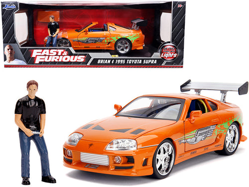 Load image into Gallery viewer, 1995 Toyota Supra Orange Metallic with Lights and Brian Figurine "Fast &amp; Furious" Movie 1/18 Diecast Model Car by Jada
