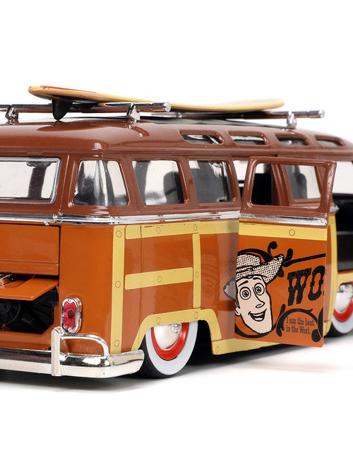 Load image into Gallery viewer, Volkswagen T1 Bus Brown with Graphics "Sheriff Woody" and Woody Diecast Figure and Surfboard "Toy Story" (1995) Movie "Hollywood Rides" Series 1/24 Diecast Model Car by Jada
