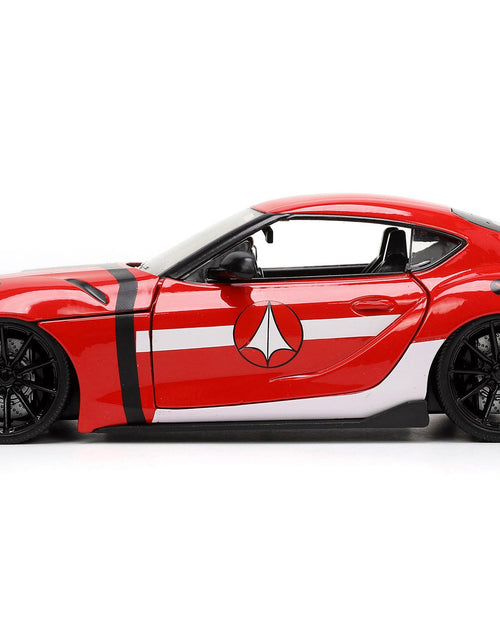 Load image into Gallery viewer, 2020 Toyota Supra Red with Graphics and Miriya Sterling Diecast Figurine "Robotech" "Hollywood Rides" Series 1/24 Diecast Model Car by Jada

