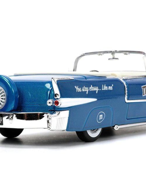 Load image into Gallery viewer, 1956 Cadillac Eldorado Convertible Blue Metallic with Cream Interior "Stay Classy" and Blue M&amp;M Diecast Figure "M&amp;M's" "Hollywood Rides" Series 1/24 Diecast Model Car by Jada
