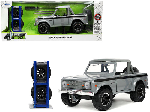 Load image into Gallery viewer, 1973 Ford Bronco Pickup Truck Gray with Black Stripes with Extra Wheels "Just Trucks" Series 1/24 Diecast Model Car by Jada
