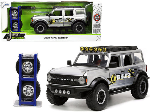 Load image into Gallery viewer, 2021 Ford Bronco Gray Metallic "KC HiLiTES" with Extra Wheels "Just Trucks" Series 1/24 Diecast Model Car by Jada
