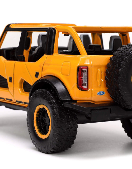 Load image into Gallery viewer, 2021 Ford Bronco Orange Metallic with Extra Wheels "Just Trucks" Series 1/24 Diecast Model Car by Jada

