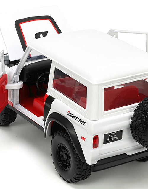 Load image into Gallery viewer, 1973 Ford Bronco #008 White with Red and Black Stripes and Red Interior with Extra Wheels "Just Trucks" Series 1/24 Diecast Model Car by Jada
