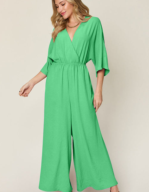 Load image into Gallery viewer, Double Take Full Size Surplice Wide Leg Jumpsuit with Pockets
