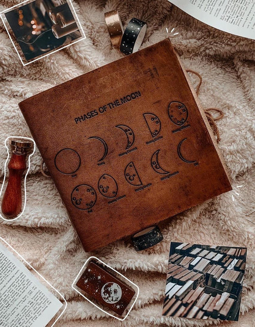 Load image into Gallery viewer, Moon Phases 7x7 Artists Embossed Leather Journal by Soothi
