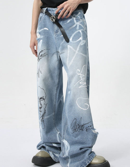 Load image into Gallery viewer, Mid Rise Graffiti Print Distressed Wide Leg Jeans
