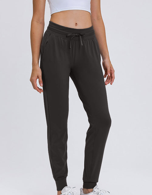 Load image into Gallery viewer, Millennia Double Take Tied Joggers with Pockets
