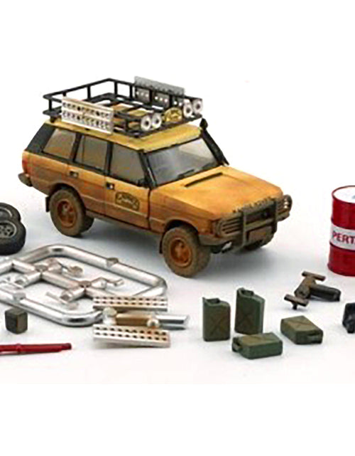 Load image into Gallery viewer, Land Rover Range Rover Classic LSE RHD (Right Hand Drive) "Camel Trophy" Yellow (Dirty Mud Version) with Roof Rack Extra Wheels and Accessories Limited Edition to 2016 pieces Worldwide 1/64 Diecast Model Car by BM Creations
