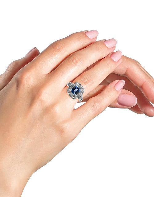 Load image into Gallery viewer, .925 Sterling Silver Diamond Accent and 8X6 mm Emerald-Shape Blue Topaz Ring (I-J Color, I2-I3 Clarity) by Infinite Jewels
