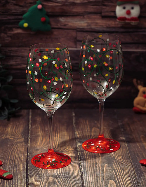 Load image into Gallery viewer, Stemmed Christmas Lights Wine Glasses Set of 2 - Hand Painted Wine Glass Ornament Light Bulbs Glasses, Perfect for Wine, Champagne, Holiday Parties and Festivities - 9.5" High, 21 oz Capacity by The Wine Savant
