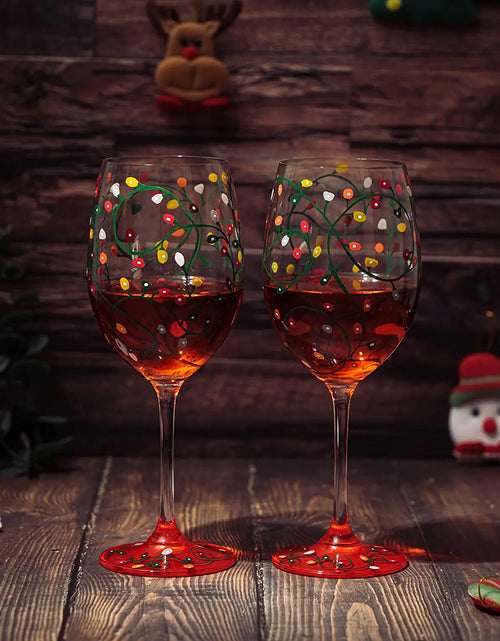 Load image into Gallery viewer, Stemmed Christmas Lights Wine Glasses Set of 2 - Hand Painted Wine Glass Ornament Light Bulbs Glasses, Perfect for Wine, Champagne, Holiday Parties and Festivities - 9.5" High, 21 oz Capacity by The Wine Savant
