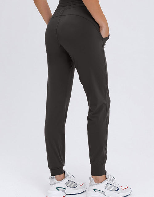 Load image into Gallery viewer, Millennia Double Take Tied Joggers with Pockets
