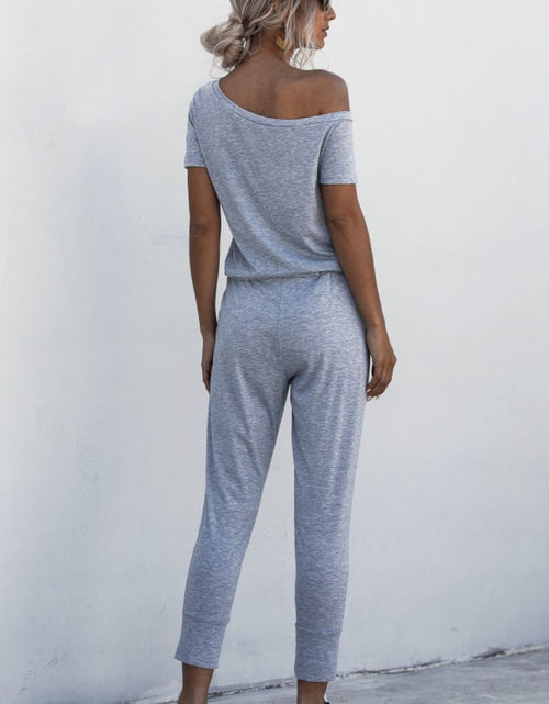 Load image into Gallery viewer, Asymmetrical Neck Tied Jumpsuit with Pockets
