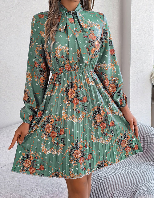Load image into Gallery viewer, Pleated Printed Tie Neck Long Sleeve Dress
