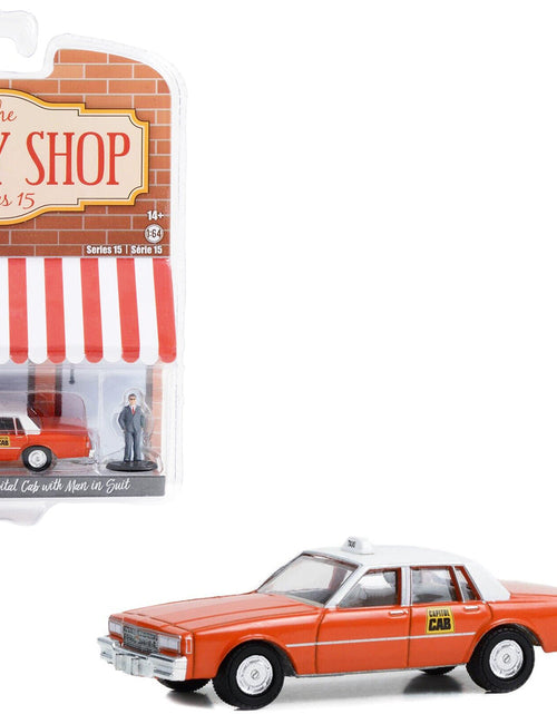 Load image into Gallery viewer, 1981 Chevrolet Impala "Capitol Cab" Taxi Orange with White Top and Man in Suit Figure "The Hobby Shop" Series 15 1/64 Diecast Model Car by Greenlight
