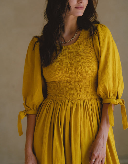 Load image into Gallery viewer, Freya Smocked Linen Midi Dress by ELF
