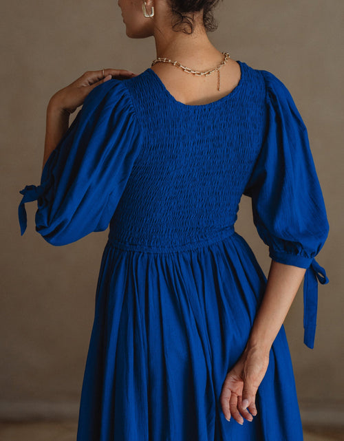 Load image into Gallery viewer, Freya Smocked Linen Midi Dress by ELF
