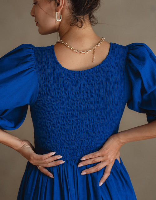 Load image into Gallery viewer, Freya Smocked Linen Midi Dress by ELF
