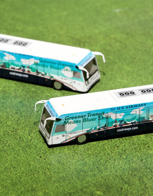 Load image into Gallery viewer, Cobus 3000 Passenger Bus White and Blue with Graphics "US Airways Shuttle Bus - Greener Transit" 2 Piece Set "Gemini 200" Series Diecast Models by GeminiJets
