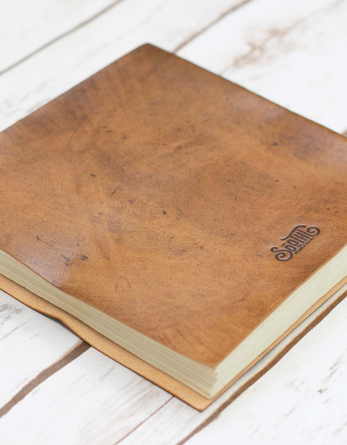 Load image into Gallery viewer, Moon Phases 7x7 Artists Embossed Leather Journal by Soothi
