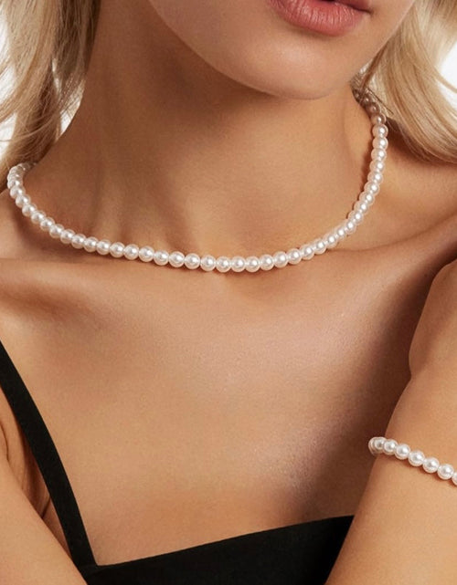 Load image into Gallery viewer, Shell Pearl Necklace And Bracelet Set by Donatello Gian
