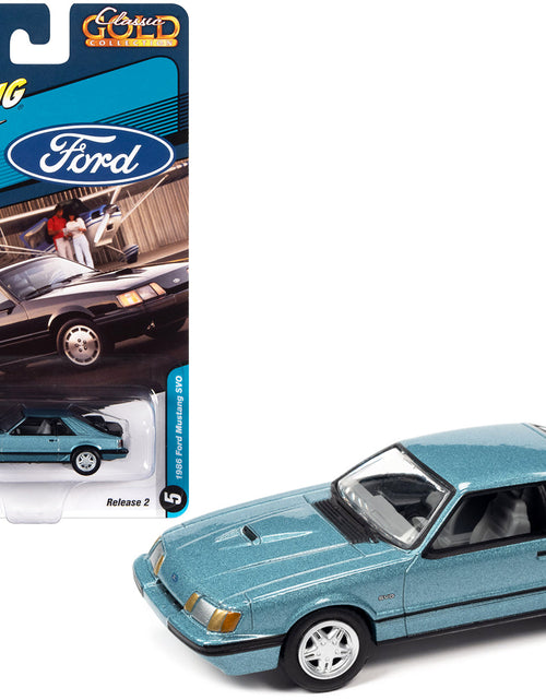 Load image into Gallery viewer, 1986 Ford Mustang SVO Light Regatta Blue Metallic with Black Stripes "Classic Gold Collection" Series Limited Edition to 12768 pieces Worldwide 1/64 Diecast Model Car by Johnny Lightning
