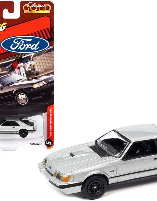 Load image into Gallery viewer, 1986 Ford Mustang SVO Silver Metallic with Black Stripes "Classic Gold Collection" Series Limited Edition to 12768 pieces Worldwide 1/64 Diecast Model Car by Johnny Lightning
