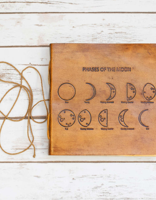 Load image into Gallery viewer, Moon Phases 7x7 Artists Embossed Leather Journal by Soothi
