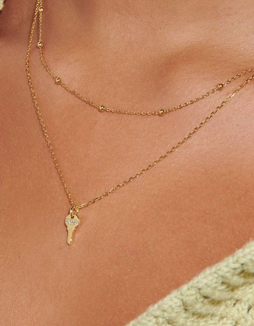Load image into Gallery viewer, Tiny Key Necklace Charm by Little Sky Stone
