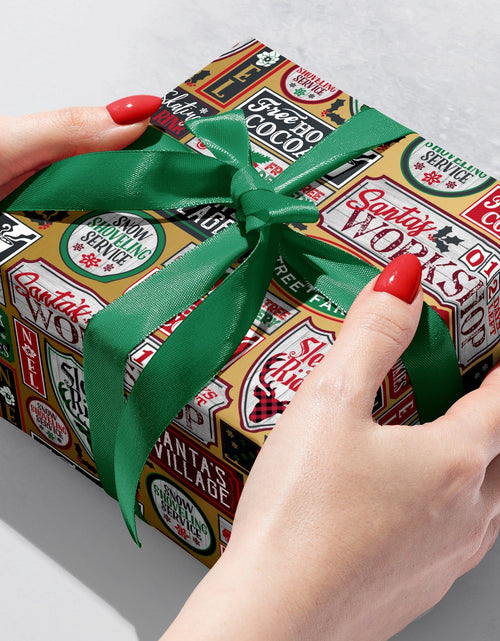 Load image into Gallery viewer, Santa Signs Gold Christmas Gift Wrap by Present Paper
