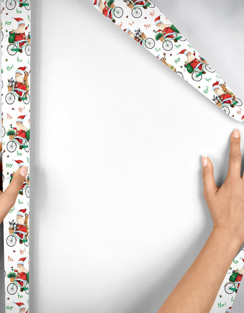 Load image into Gallery viewer, Santa Bicycle Christmas Gift Wrap by Present Paper
