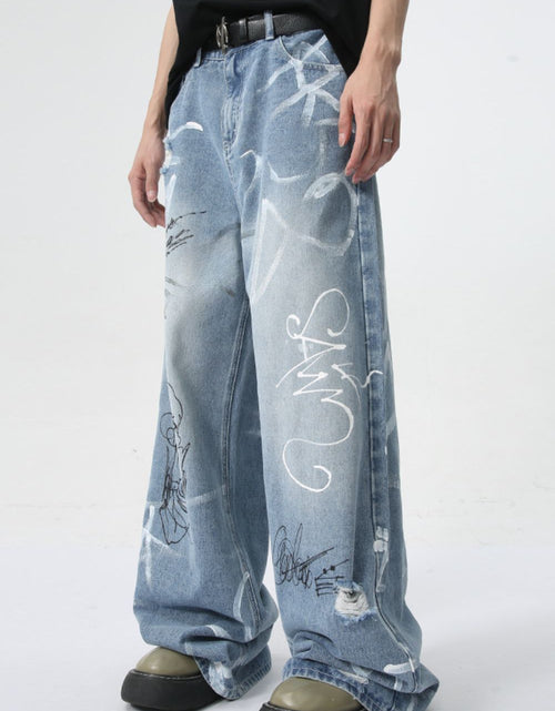 Load image into Gallery viewer, Mid Rise Graffiti Print Distressed Wide Leg Jeans

