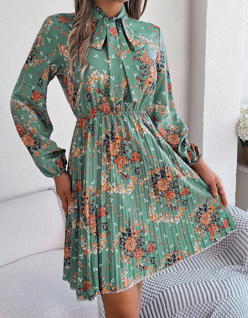 Load image into Gallery viewer, Pleated Printed Tie Neck Long Sleeve Dress
