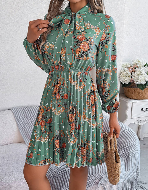 Load image into Gallery viewer, Pleated Printed Tie Neck Long Sleeve Dress

