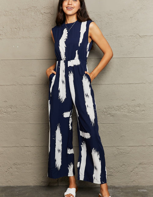 Load image into Gallery viewer, Perfee Printed Round Neck Cutout Jumpsuit with Pockets
