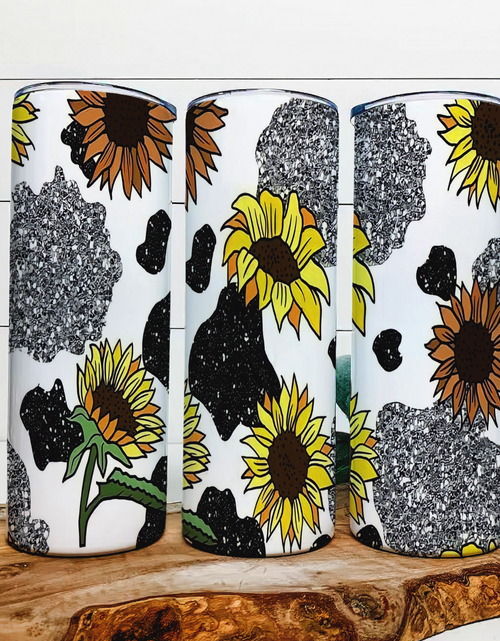 Load image into Gallery viewer, faux glitter Cow Print Sunflowers - 20 oz Steel Skinny Tumbler - Optional Blue Tooth Speaker - Speaker Color will Vary by Rowdy Ridge Co
