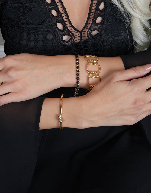 Load image into Gallery viewer, Gold Love Knot Necklace by Hollywood Sensation®
