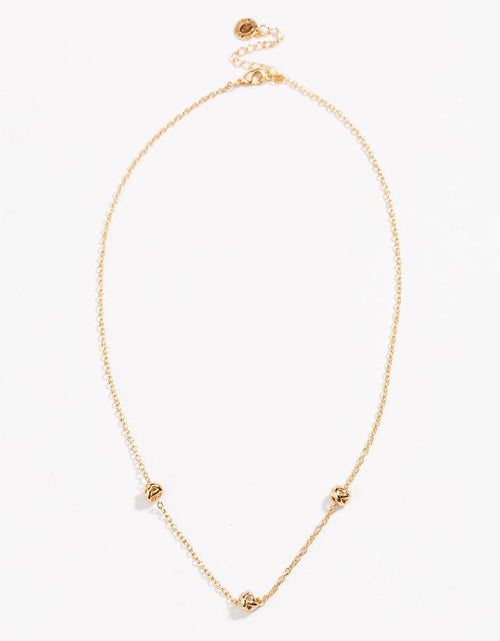 Load image into Gallery viewer, Gold Love Knot Necklace by Hollywood Sensation®
