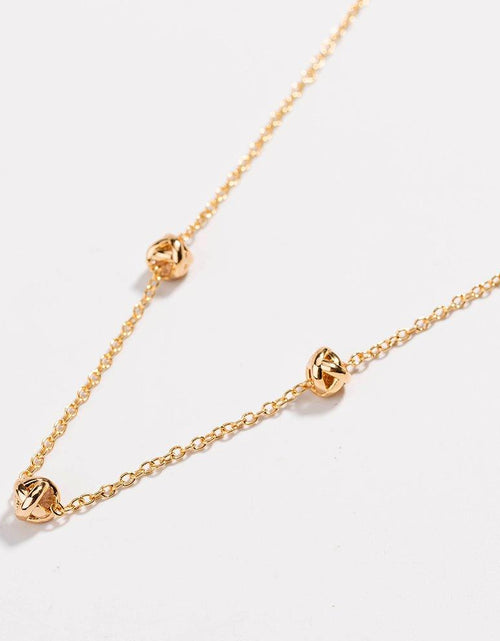 Load image into Gallery viewer, Gold Love Knot Necklace by Hollywood Sensation®

